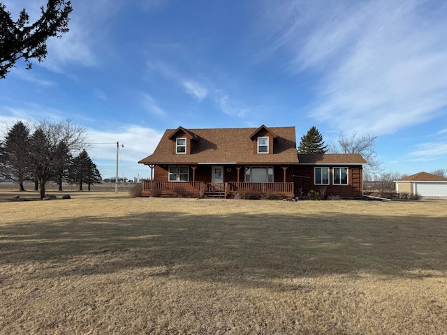 cape cod home with a porch and a front yard