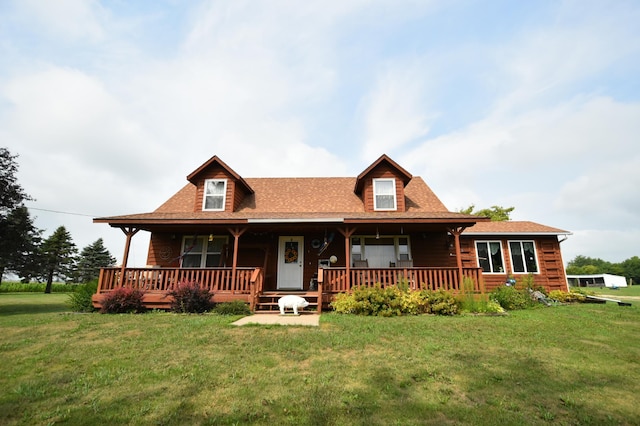 log home with a front lawn and covered porch