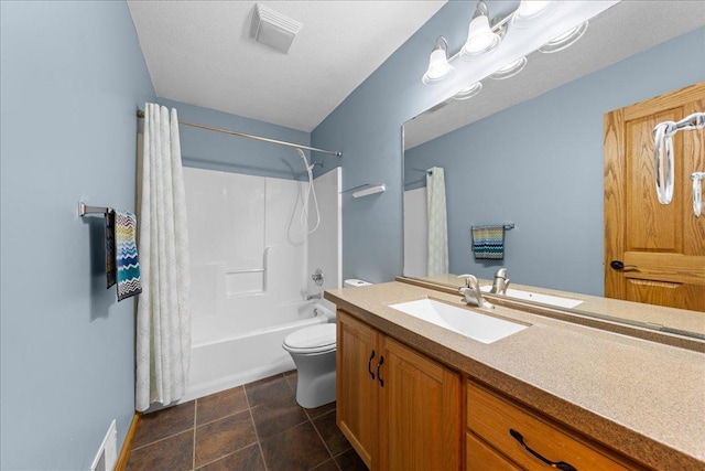 full bathroom featuring vanity, shower / bath combination with curtain, tile patterned floors, and toilet