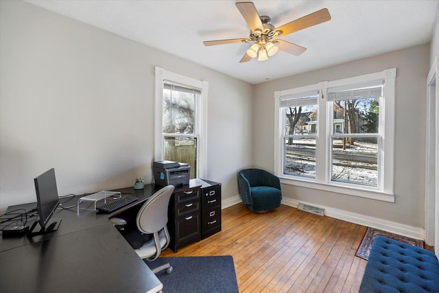 office area with hardwood / wood-style floors, a healthy amount of sunlight, and ceiling fan