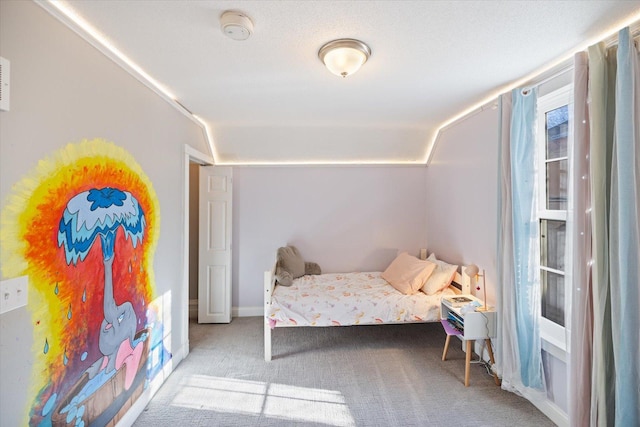 bedroom featuring light colored carpet and lofted ceiling