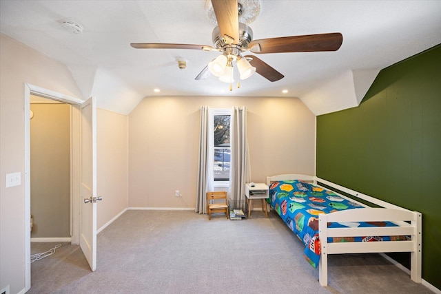 bedroom with lofted ceiling, light colored carpet, and ceiling fan