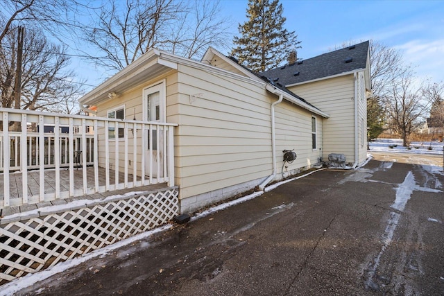 view of side of property with a deck