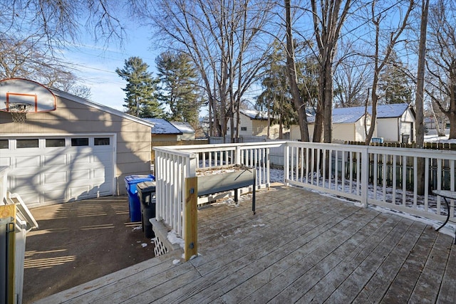 deck featuring a garage and an outdoor structure