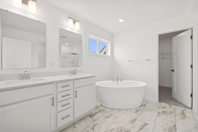 bathroom featuring independent shower and bath and vanity