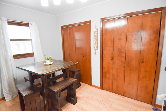 dining space with light hardwood / wood-style flooring