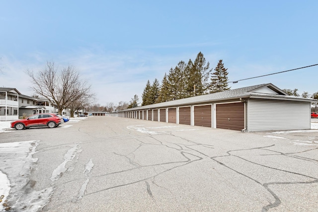 view of street featuring community garages
