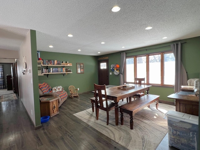 dining space featuring recessed lighting, a textured ceiling, and wood finished floors