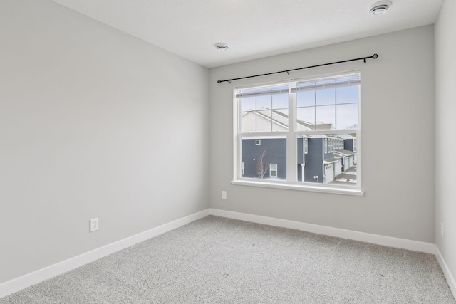 unfurnished room featuring carpet floors