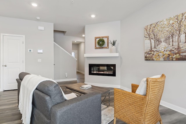 living room with dark hardwood / wood-style floors