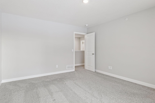 unfurnished room with carpet