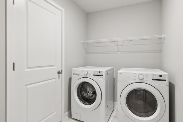 laundry room with washer and clothes dryer