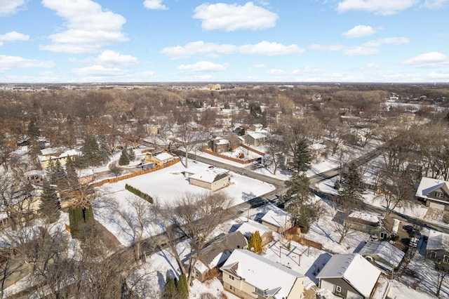 snowy aerial view featuring a residential view