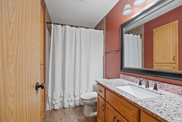 bathroom with vanity, a textured ceiling, wood-type flooring, and toilet