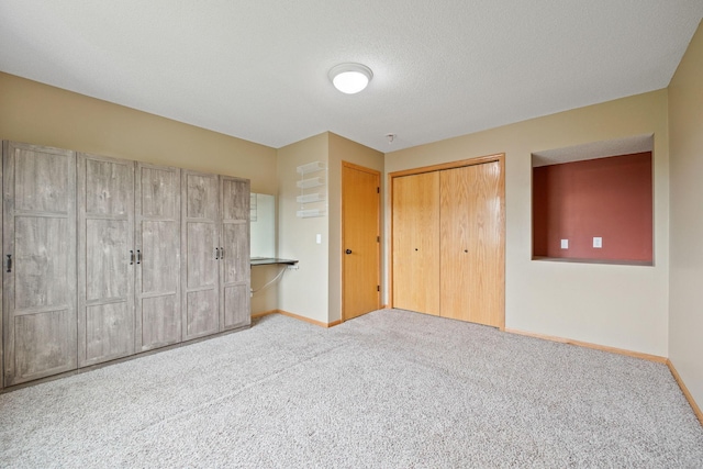 unfurnished bedroom with carpet flooring