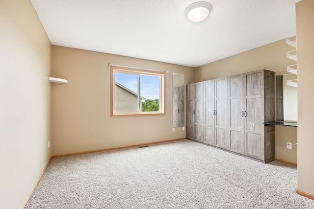 unfurnished bedroom featuring light colored carpet