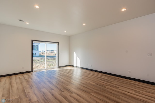 empty room with light hardwood / wood-style floors