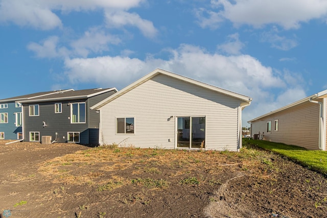 back of house featuring cooling unit