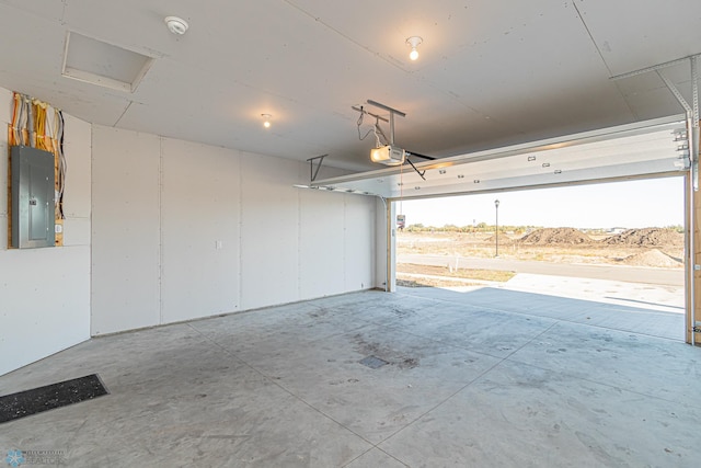 garage featuring a garage door opener and electric panel