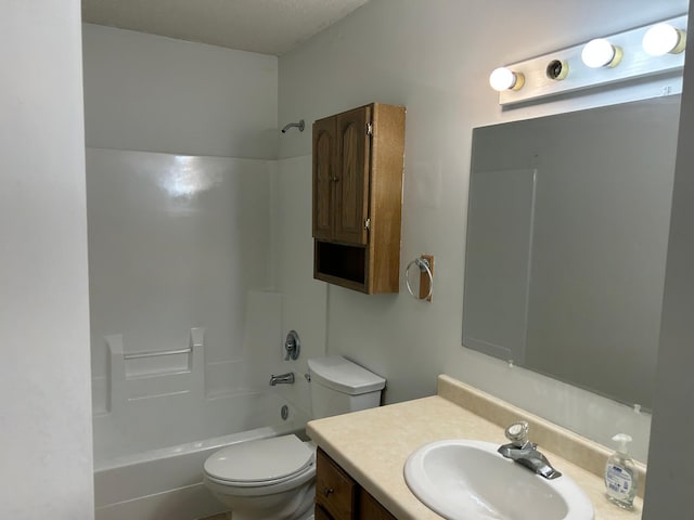 full bathroom with vanity, toilet, and  shower combination