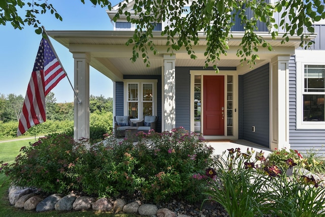 entrance to property featuring covered porch