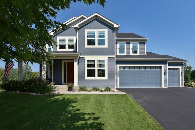 craftsman-style home featuring a front lawn