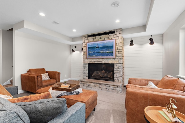 living room with light colored carpet and a fireplace