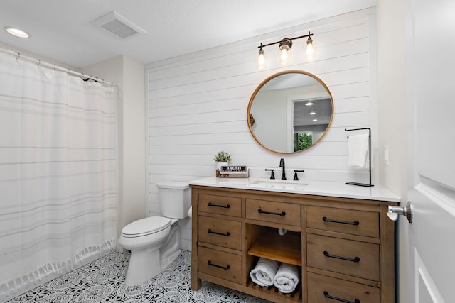 bathroom featuring tile patterned flooring, vanity, curtained shower, toilet, and wood walls