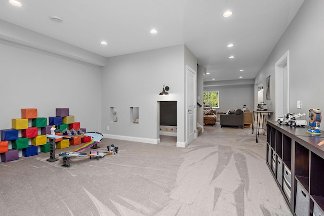 game room featuring light colored carpet