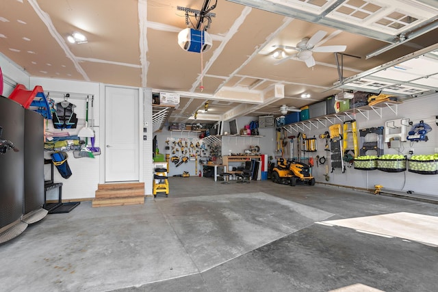 garage featuring a garage door opener and a workshop area