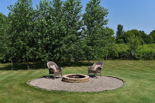 view of yard with a fire pit