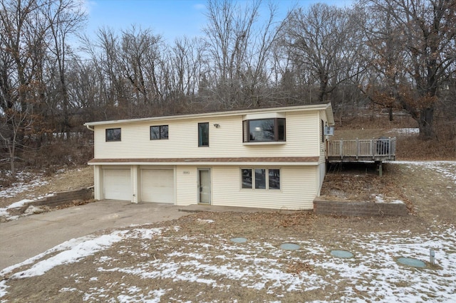 exterior space with a wooden deck and a garage