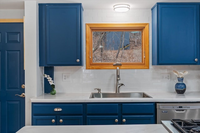 kitchen with tasteful backsplash, blue cabinets, and sink