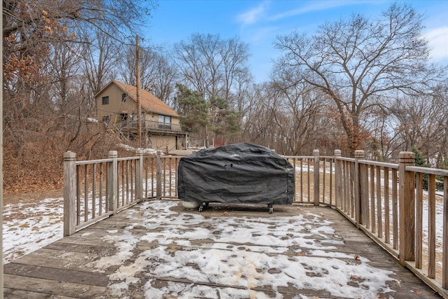 snow covered deck featuring grilling area