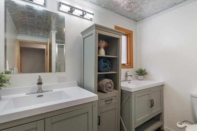 bathroom featuring ornamental molding and vanity