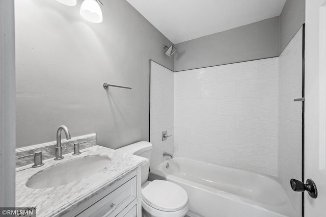 full bathroom featuring shower / bathtub combination, vanity, and toilet