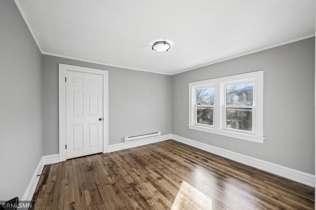 unfurnished room featuring a baseboard radiator, wood-type flooring, and ornamental molding