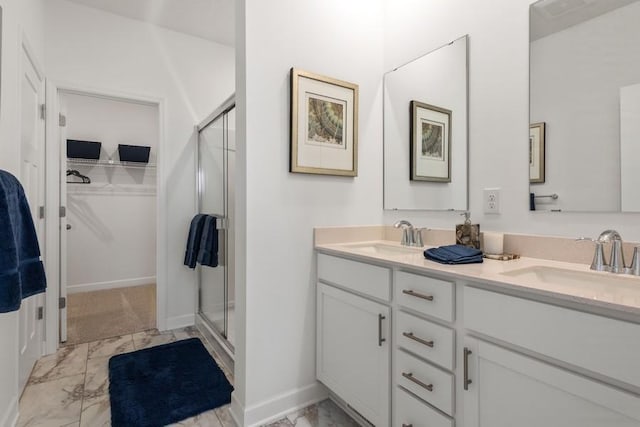 bathroom with walk in shower and vanity