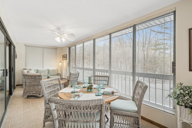 sunroom with ceiling fan