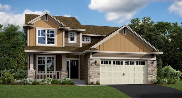 craftsman inspired home with a garage and a front lawn