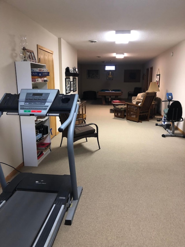 workout room featuring carpet