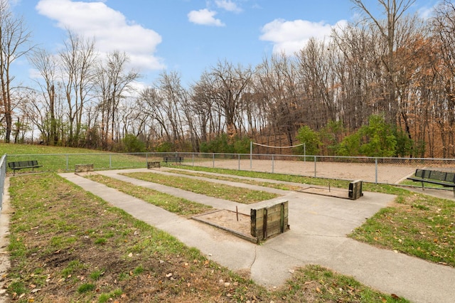 surrounding community featuring volleyball court