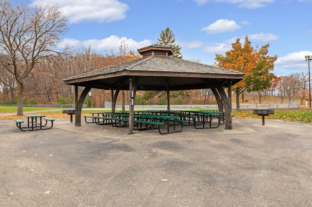 surrounding community featuring a gazebo and fence