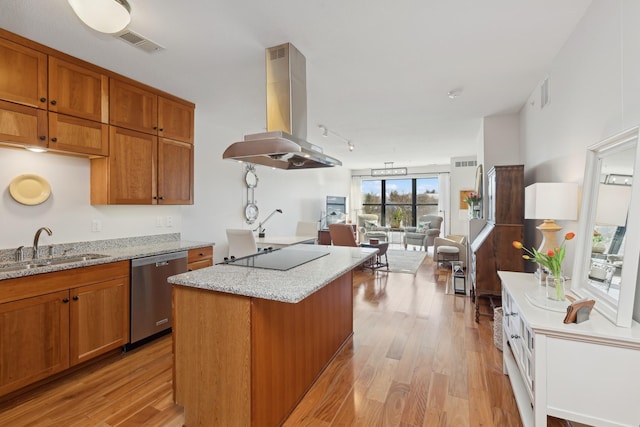 kitchen with visible vents, a sink, stainless steel dishwasher, black electric stovetop, and island range hood