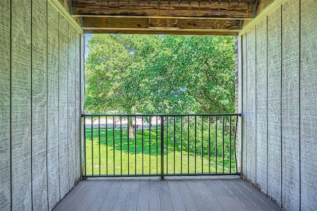 wooden terrace featuring a yard