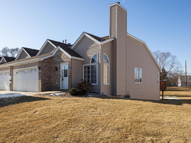 view of front of home with a garage and a front yard