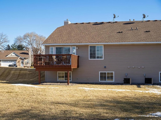 back of property featuring central AC unit, a yard, and a deck