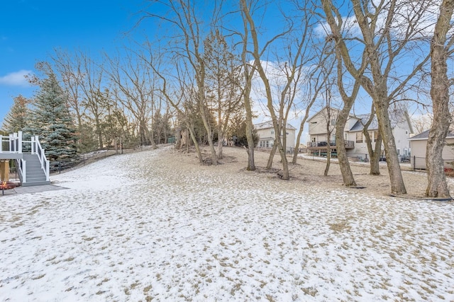 view of yard layered in snow