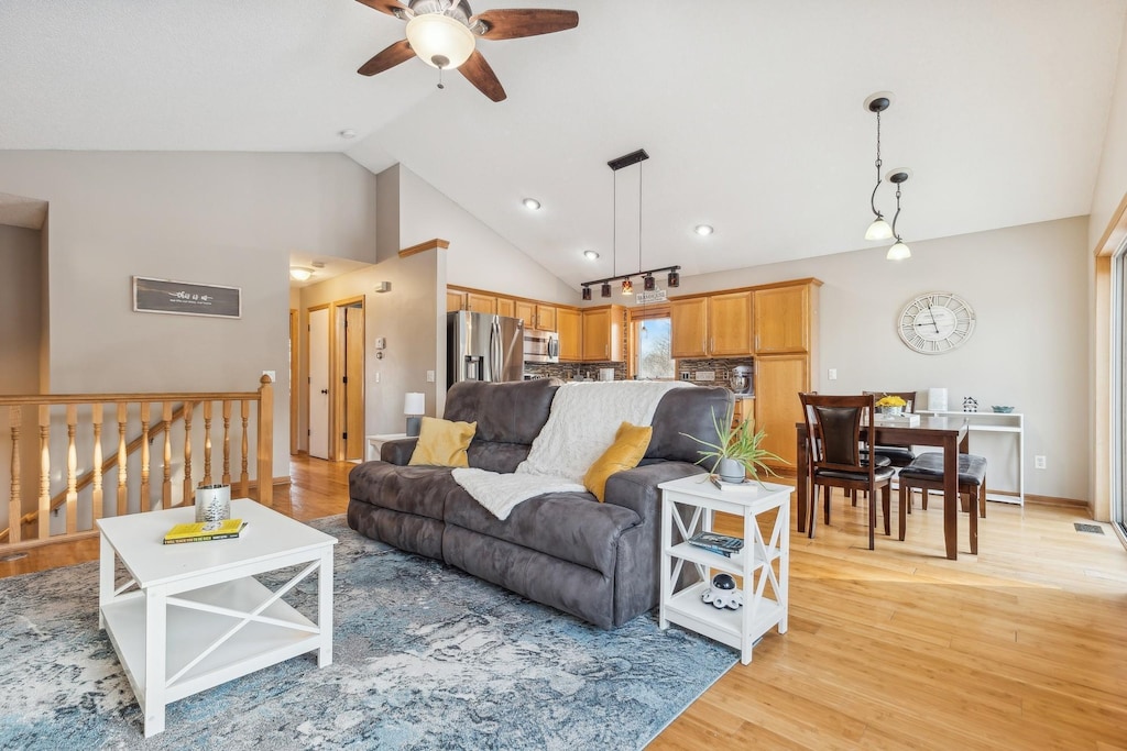 2184 Jean Way, Elko New Market, MN 55054 - living room with light wood-type flooring, high vaulted ceiling, and ceiling fan