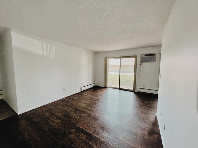 empty room featuring a textured ceiling, a baseboard radiator, dark hardwood / wood-style floors, and a wall mounted AC